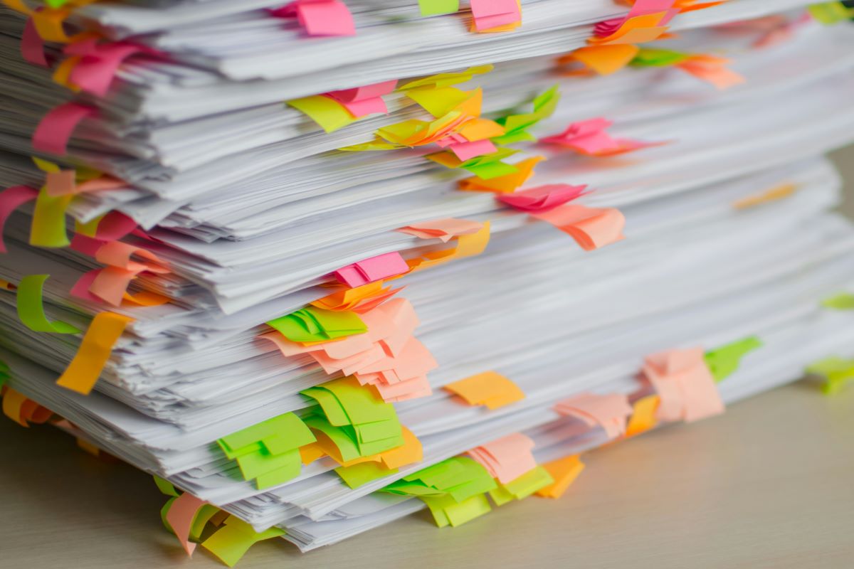 stack of paperwork with coloured tags